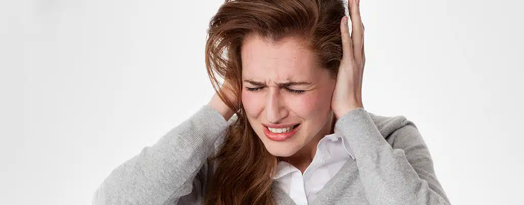 The Persistent Buzz of Tinnitus: Causes, Symptoms, and Solutions